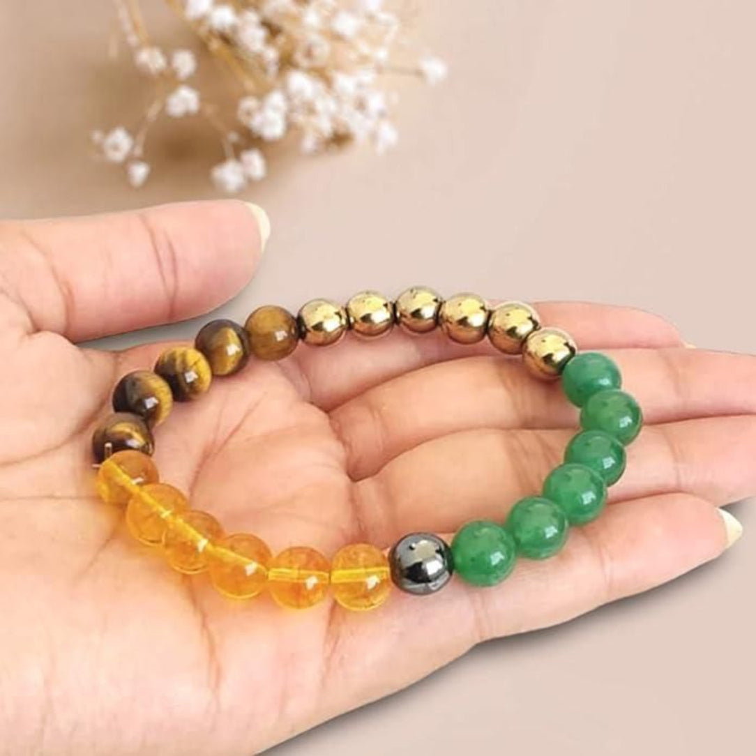 Beaded bracelet with multicolored beads held in a hand against a neutral background