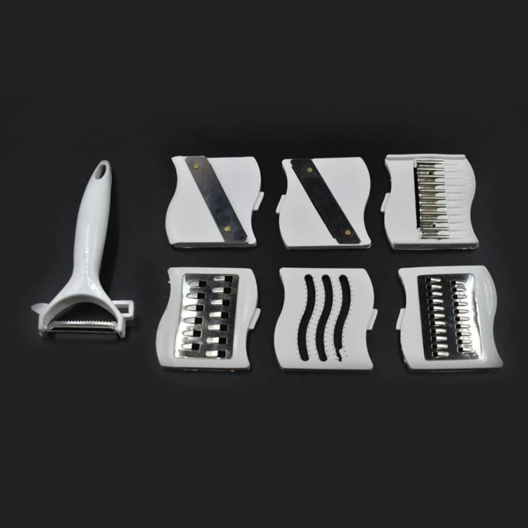 Set of white kitchen tools with interchangeable blades on a black background