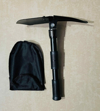 Black folding ice axe with sheath on a beige background