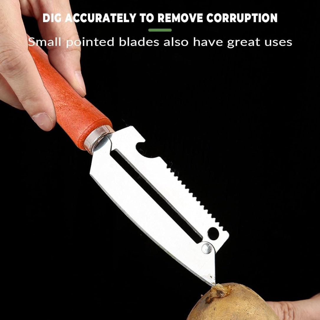 Hand holding a small pointed blade tool to cut a potato against a black background.