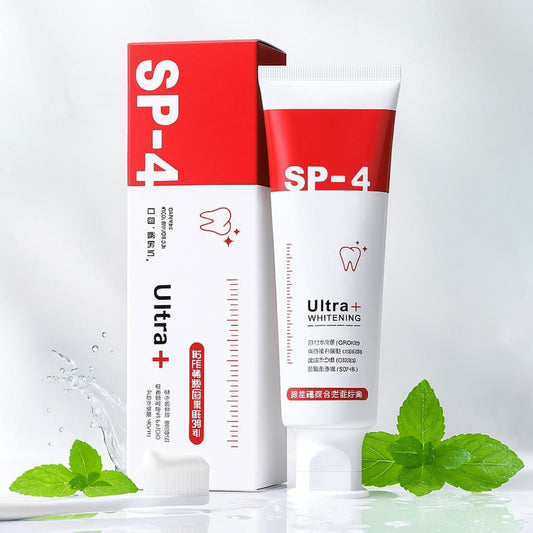 SP-4 Ultra Whitening toothpaste tube and packaging on a white background with mint leaves.