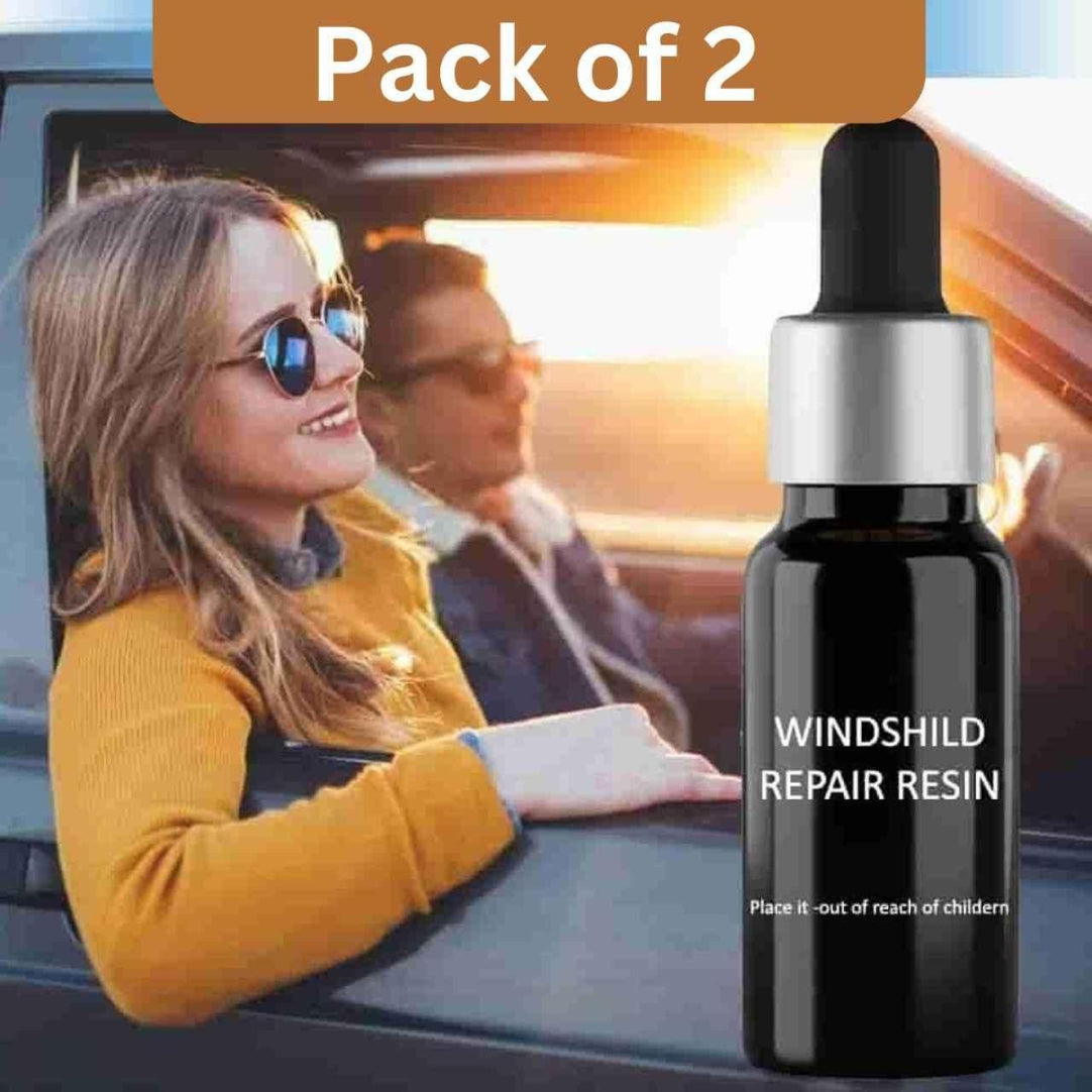 Bottle of Windshield Repair Resin with a scenic background of a couple in a car.