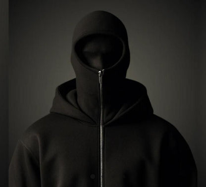 Dark hooded jacket with zipper on a gray background