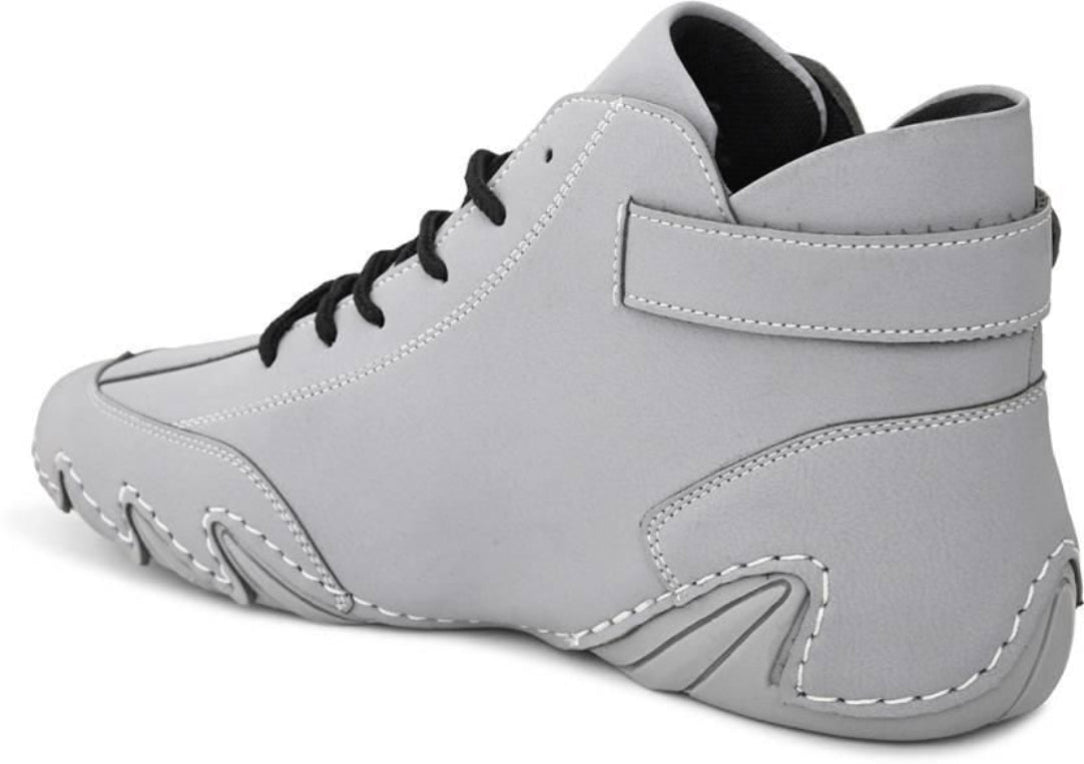 Gray high-top sneaker with black laces on a white background