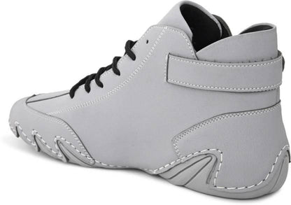 Gray high-top sneaker with black laces on a white background