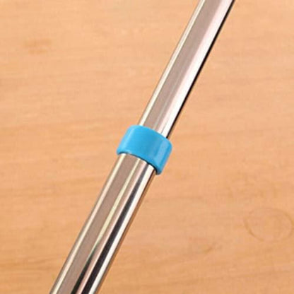 Metal rod with a blue band on a wooden surface