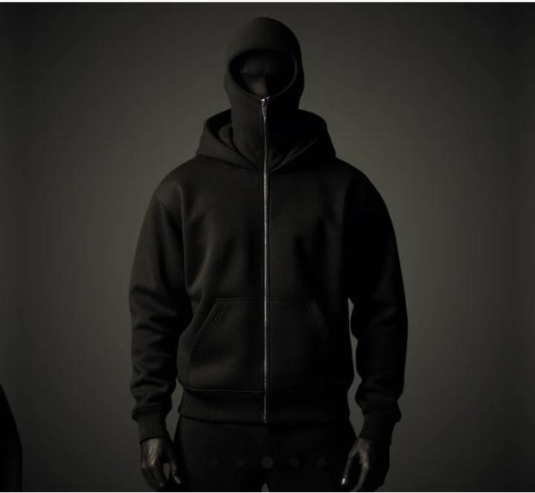 Dark hoodie with a zipper on a dark background