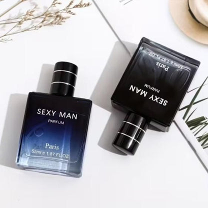 Two 'SEXY MAN PARFUM' perfume bottles on a white surface with minimal background.