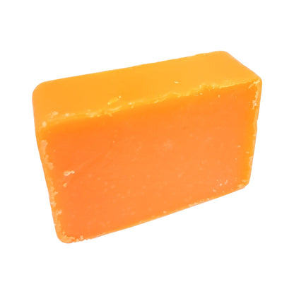Orange bar of soap on a white background