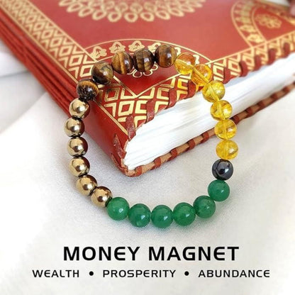 Colorful beaded bracelet on a red book with 'Money Magnet' text