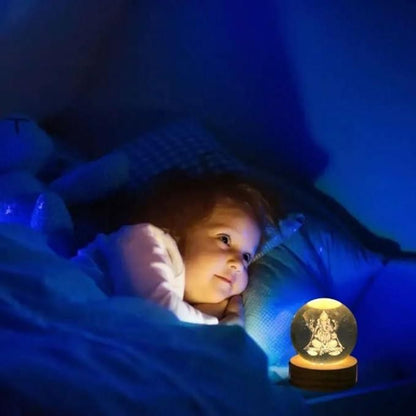 Child lying in bed under a blanket with a glowing crystal ball on a nightstand.