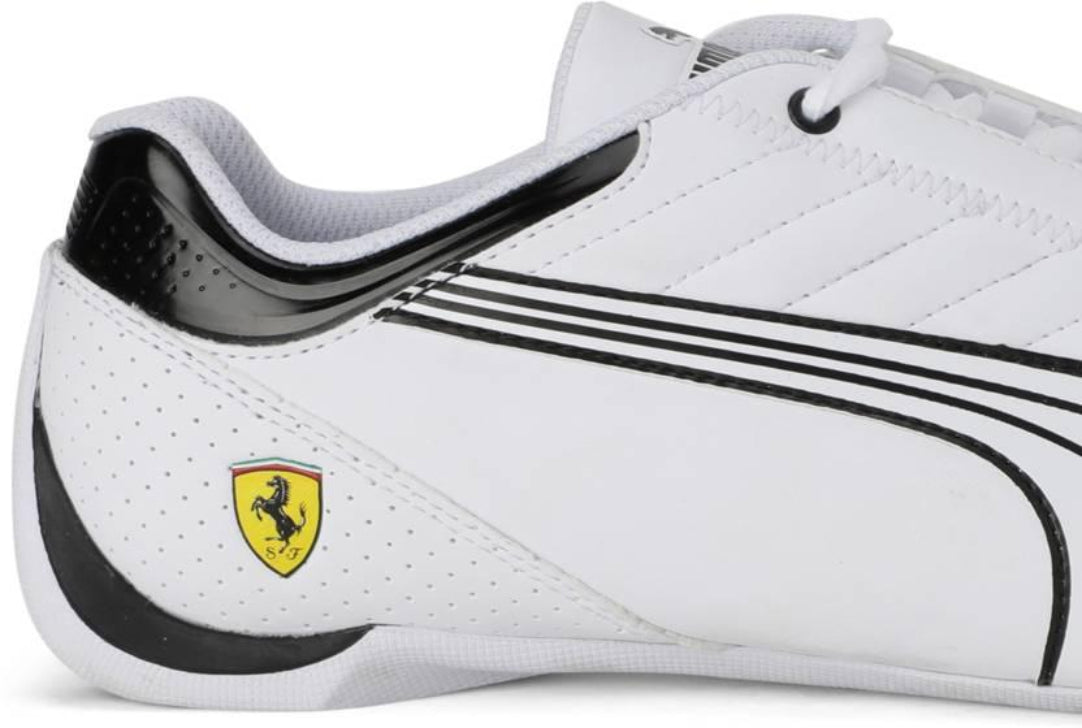 White sneaker with black accents and Ferrari logo on a white background