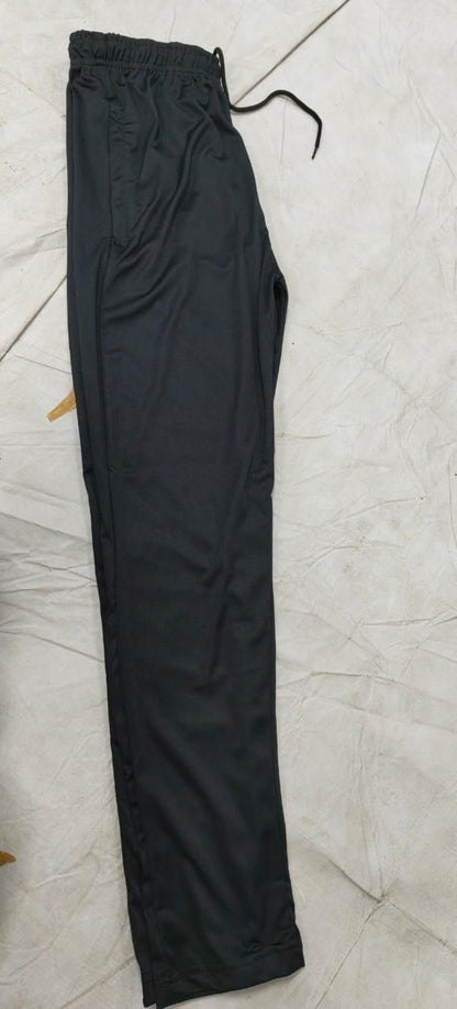 Black pants on a light tiled floor