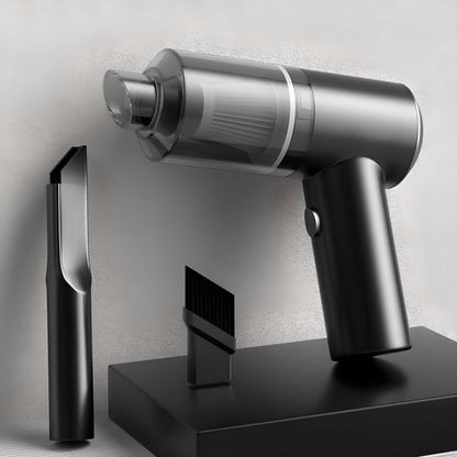 Black and silver handheld vacuum cleaner with attachments on a light gray background