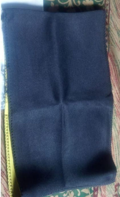 Blue fabric folded on a patterned surface