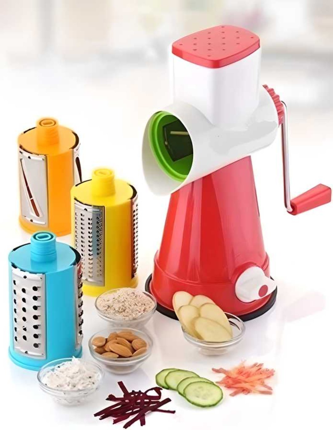 A colorful 4-in-1 rotary drum vegetable grater and slicer set with various drum attachments, displaying the functionality of grating and slicing vegetables.