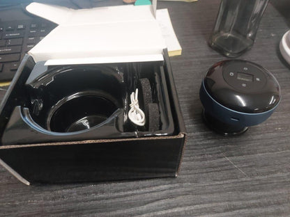 Black electronic device with a cable on a desk