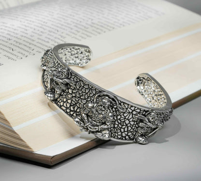 Decorative silver bracelet on an open book