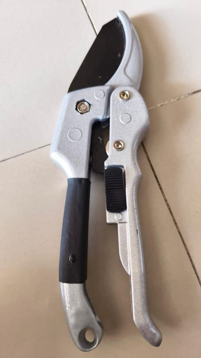 Garden pruner on a light-colored floor