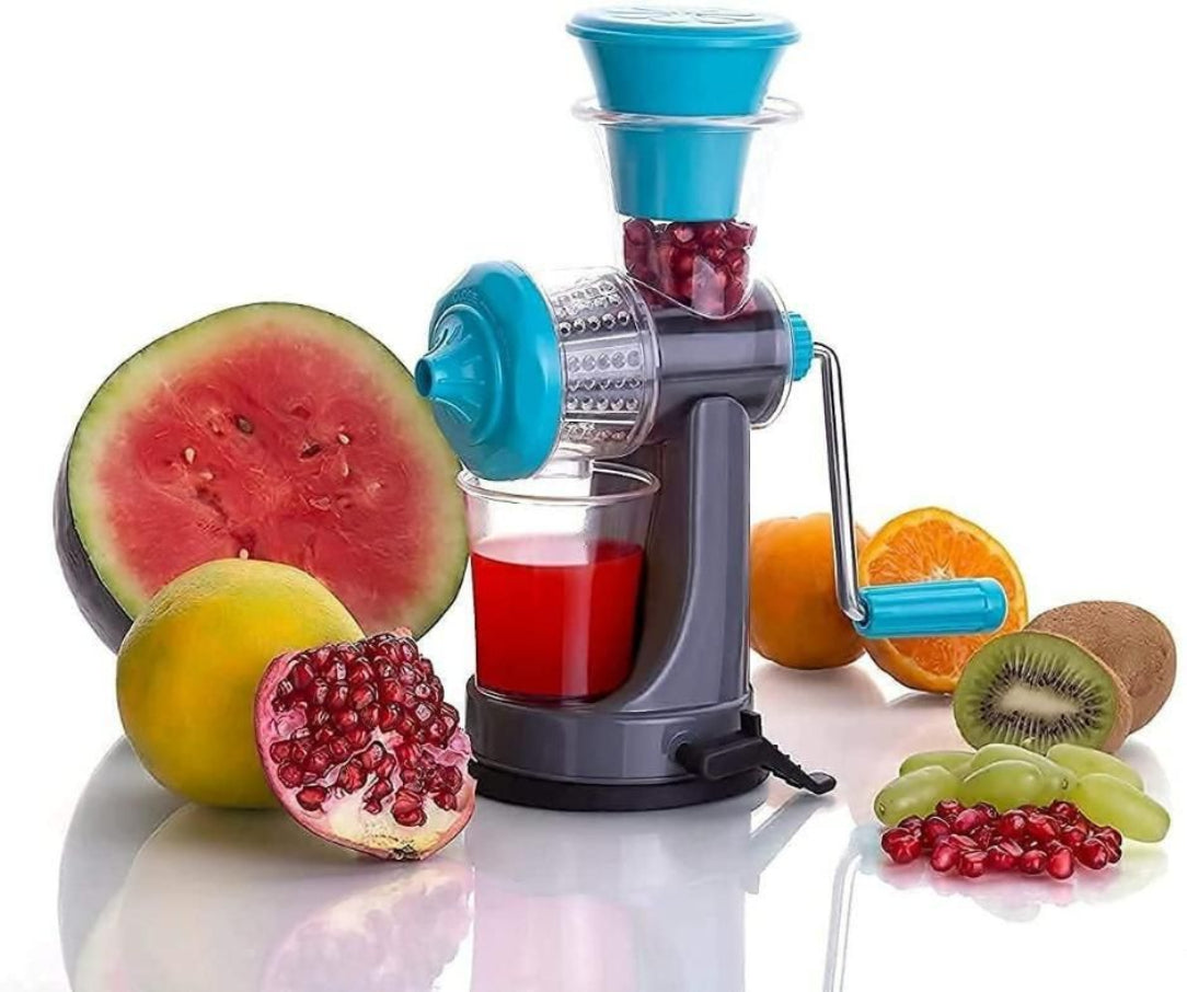 Juicer with fruits and vegetables on a white background