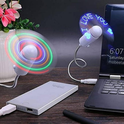Two USB fans on a desk with a laptop and power bank.