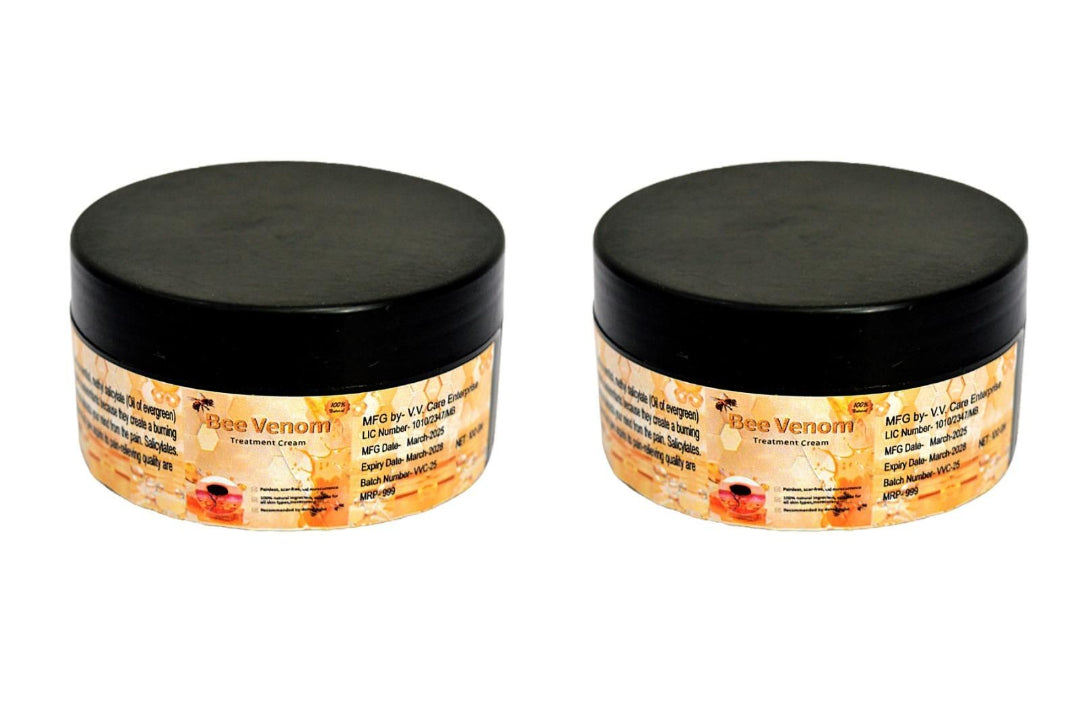 Two jars of Bee Venom cream with black lids on a white background