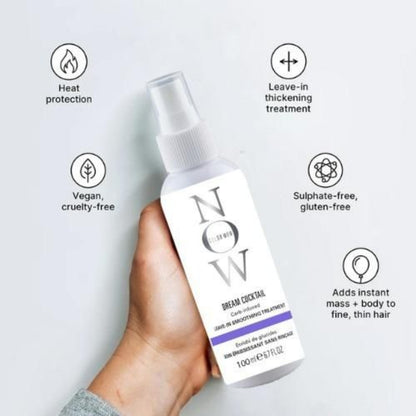 Hand holding a hair treatment bottle with text highlighting features on a white background