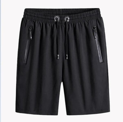 Black shorts with zippers on a white background