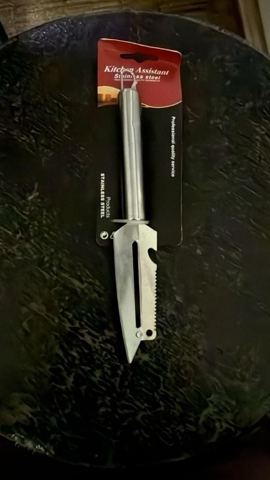 Multitool knife on a dark surface with a brand label