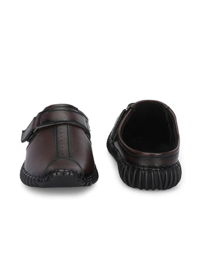 Brown leather shoes with a buckle on a white background