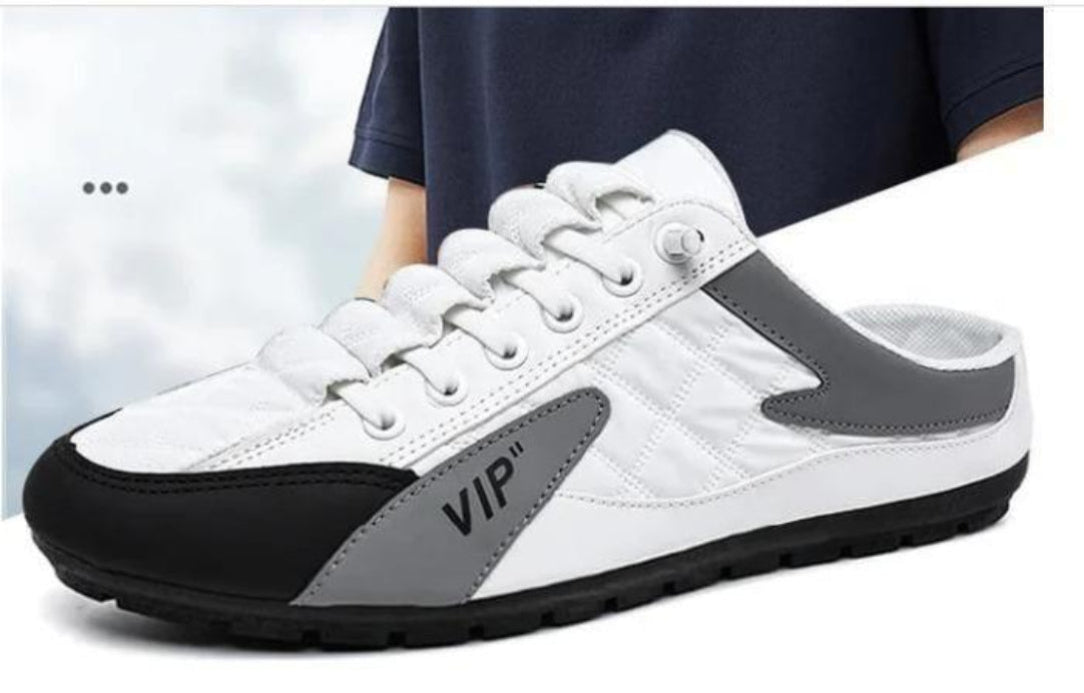 White sneaker with gray and black accents and 'VIP' branding on a white background