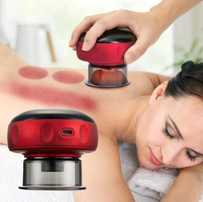 Woman receiving massage therapy with a red handheld massager device.