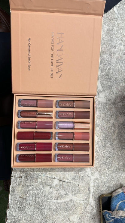 Set of lipsticks in a 'Fantasy' box on a textured surface