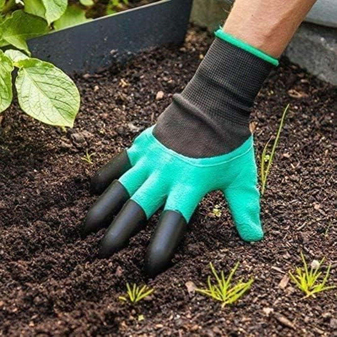 Gardening glove with digging nails being used on soil