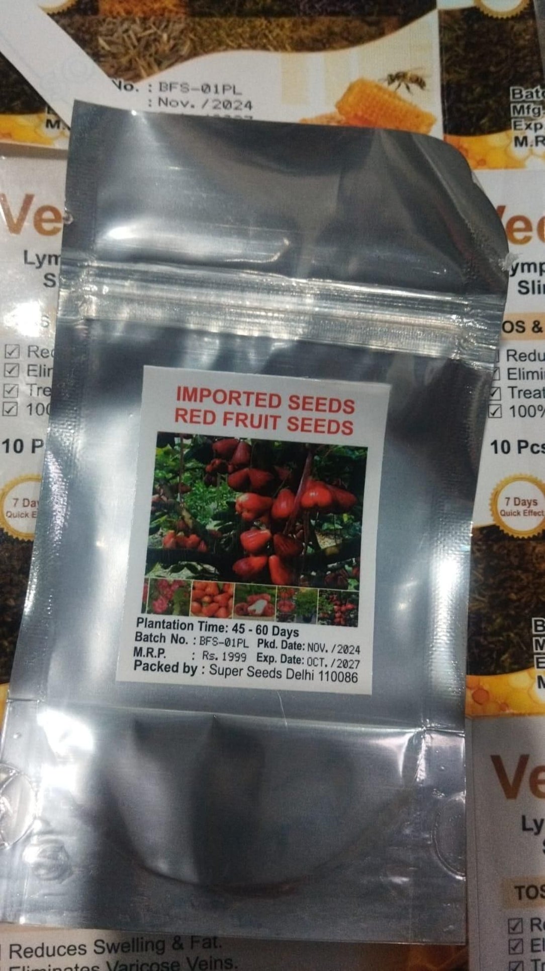 Package of imported red fruit seeds with a clear front