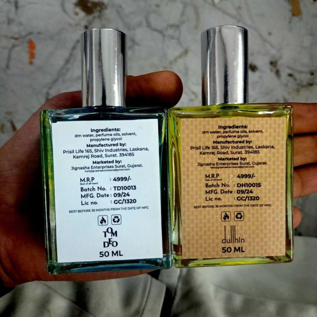 Two perfume bottles held by a hand with visible labels.
