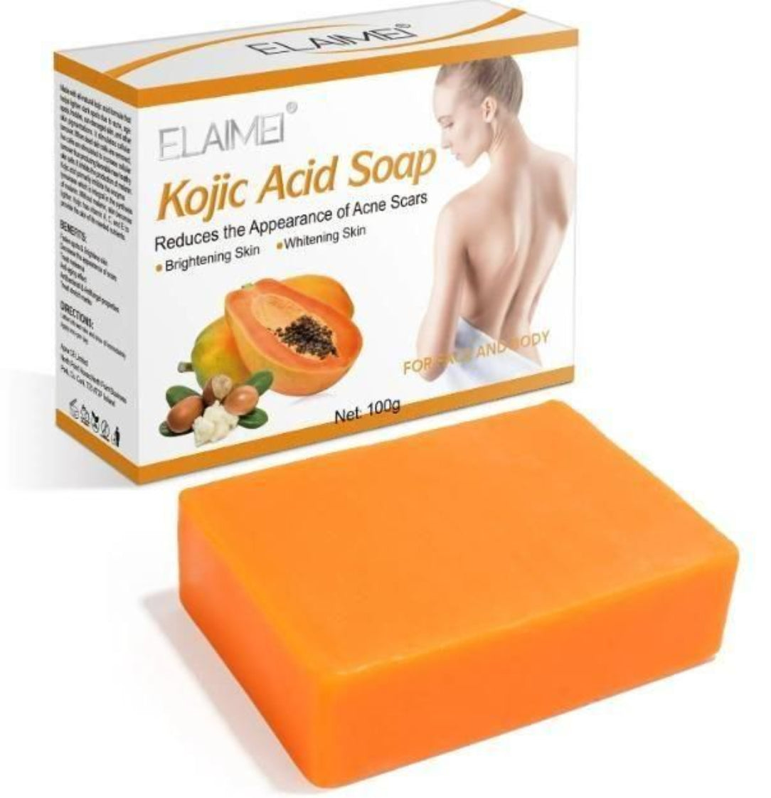 Orange bar of soap with Elai Mei Kojic Acid Soap packaging on a white background