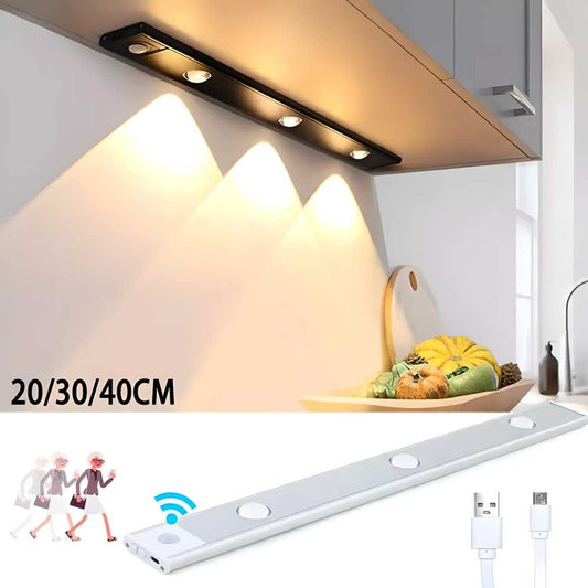 Under-cabinet LED light strip with USB cable and wireless remote control on a kitchen counter.