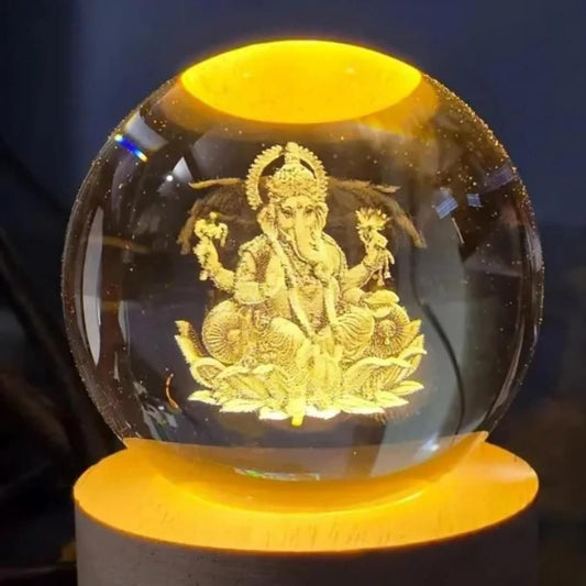Crystal ball with engraved figure on a dark background