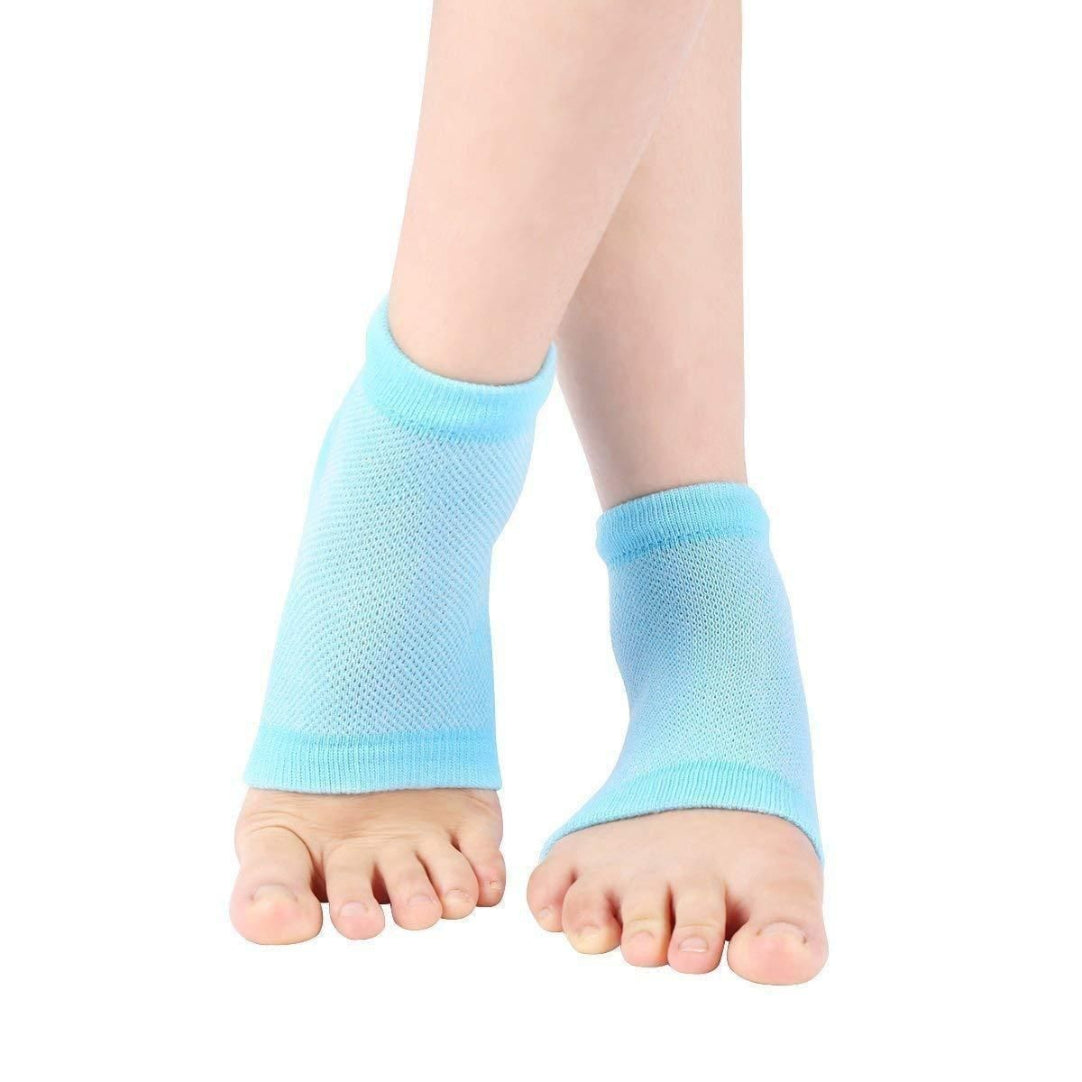 Light blue gradient socks on a child's feet against a white background