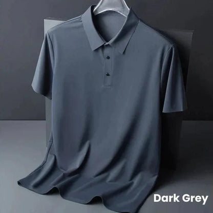 Dark grey polo shirt on a hanger against a dark background