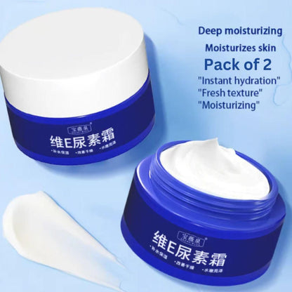 Two blue jars of moisturizing cream with a white applicator on a light blue background.