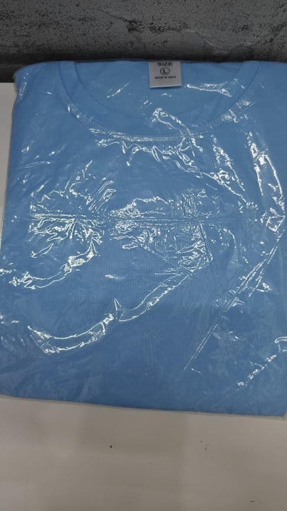 Blue t-shirt with a clear plastic wrap on a white surface