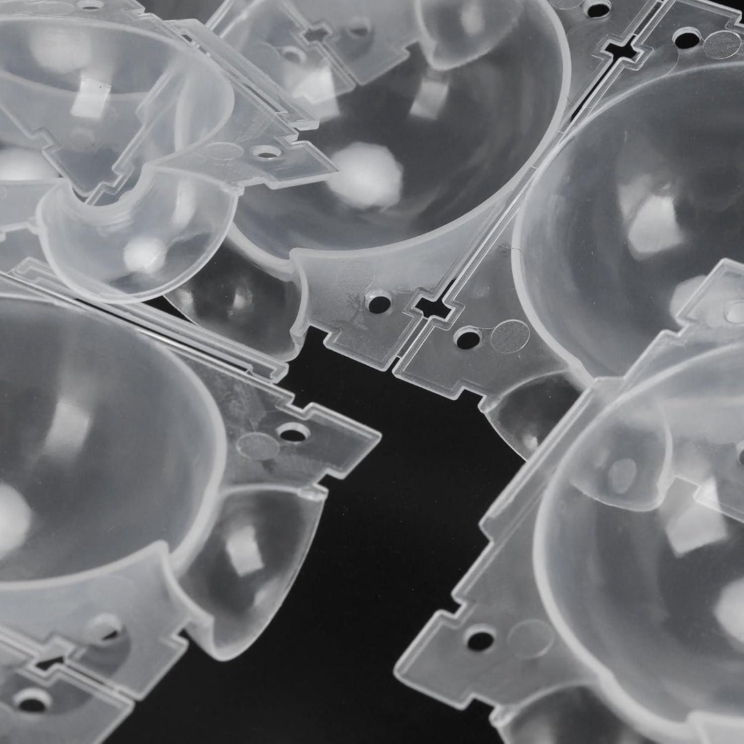 Clear plastic components on a black background