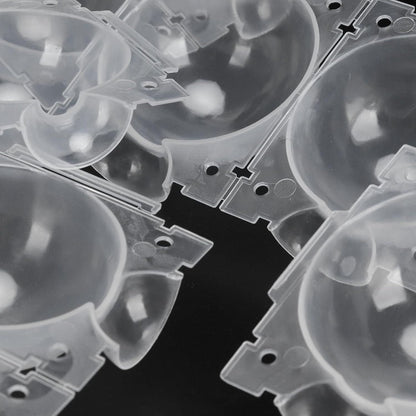 Clear plastic components on a black background