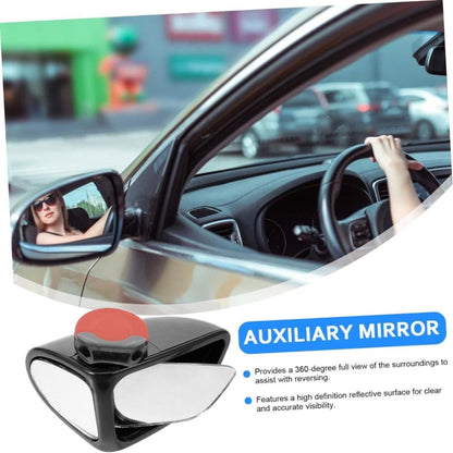Car interior with an auxiliary mirror and a blurred city street background