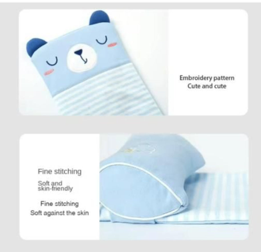 Cute blue pillow with bear design and text about embroidery pattern and softness.