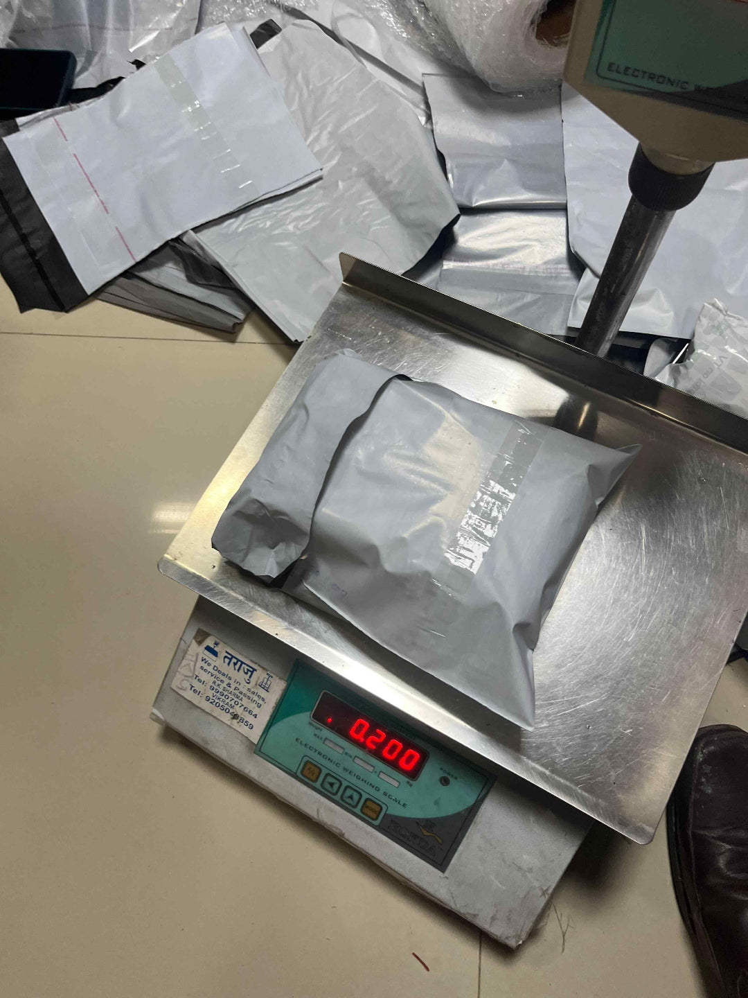 Digital scale with a bag on it, used for weighing items.