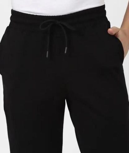 Black pants with a drawstring on a white background