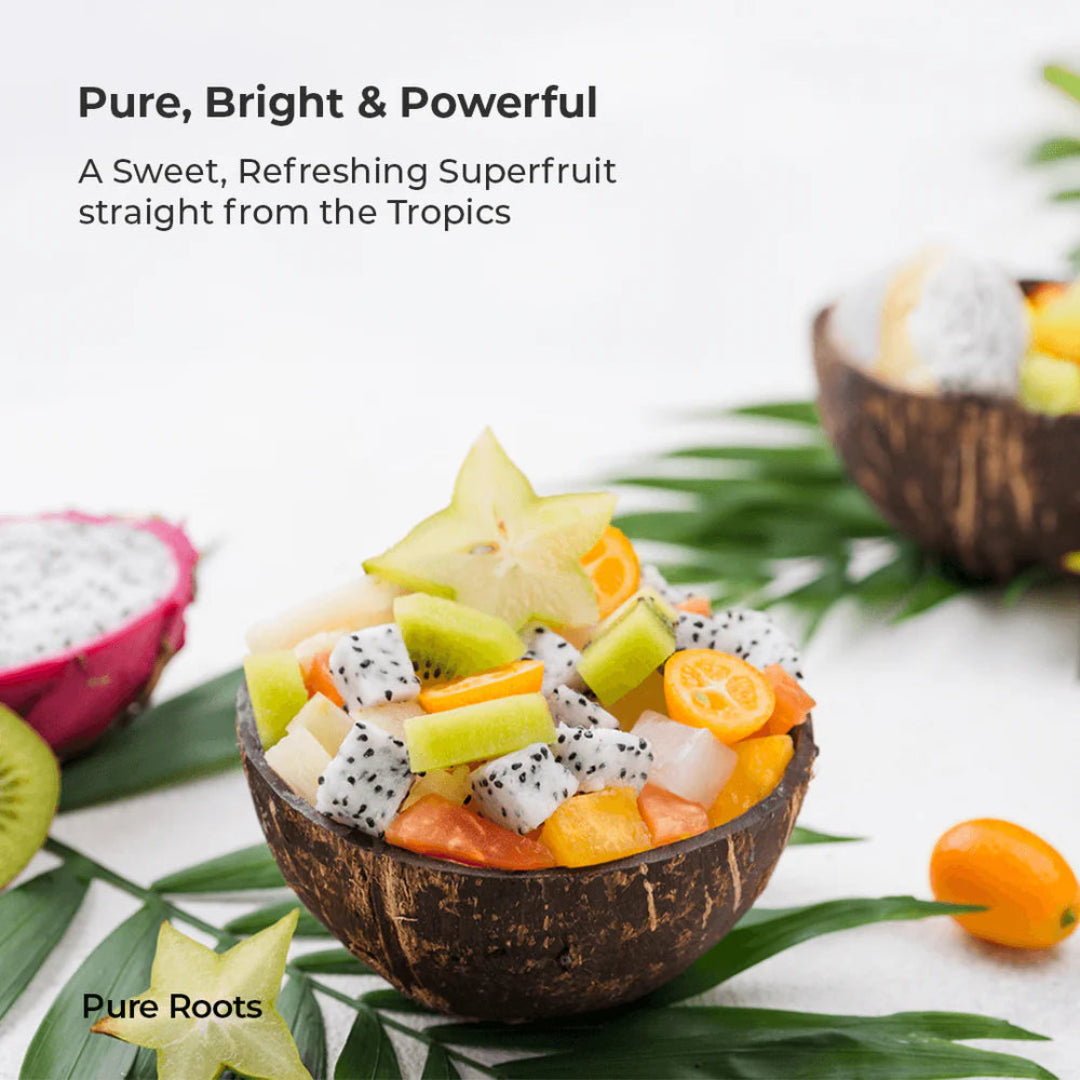 Fruit salad in a coconut bowl with tropical leaves and text about superfruits.